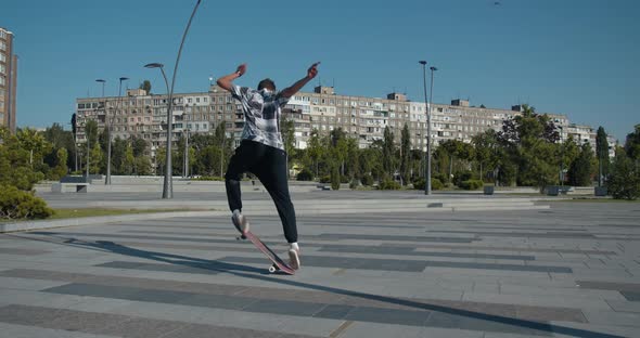 Young Man Skateboarding, Doing Kickflips, Street Sports, 