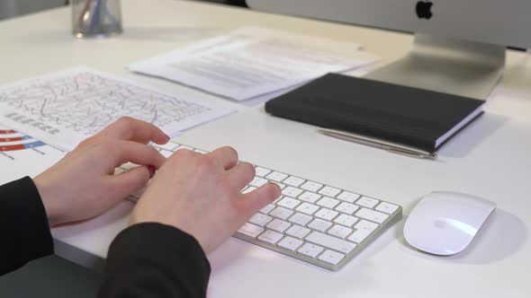 Woman's hands typing