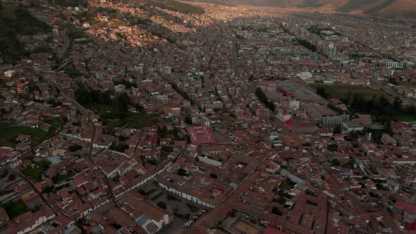 4k aerial view at sunset over the city centre and plaza de armas in Cusco, capital of the inca. Doll