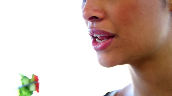 woman eating salad