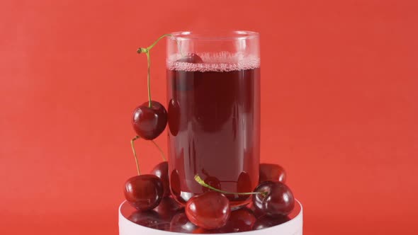 Cherry juice in close-up. alt
