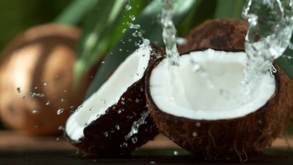 Super Slow Motion Shot of Water Splashing on Coconut at .