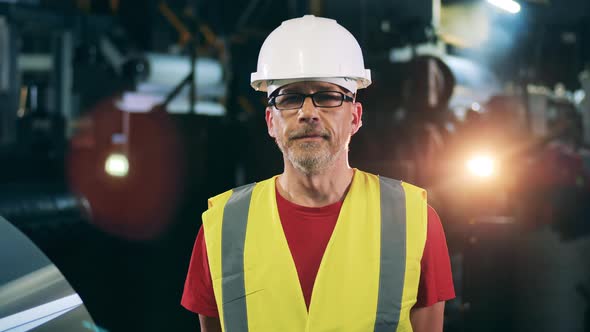 Factory Unit with a Male Engineering Specialist in Safety Wear
