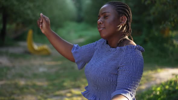 Side View Joyful Confident Plussize Woman Dancing in Slow Motion in Summer Park