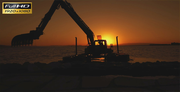 Excavator Working In The Sunset
