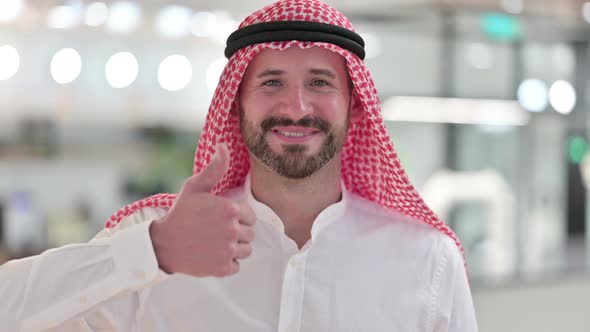 Positive Arab Businessman Doing Thumbs Up 