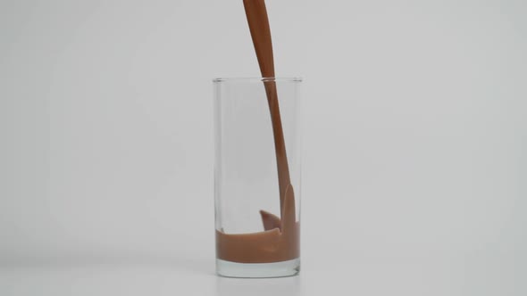 Super Slow Motion of Pouring Chocolate in Transparent Glass at 1000 Fps