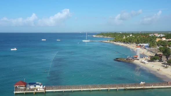 Dominicus Beach at Bayahibe with Caribbean Sea Sandy Seashore Lighthouse and Pier