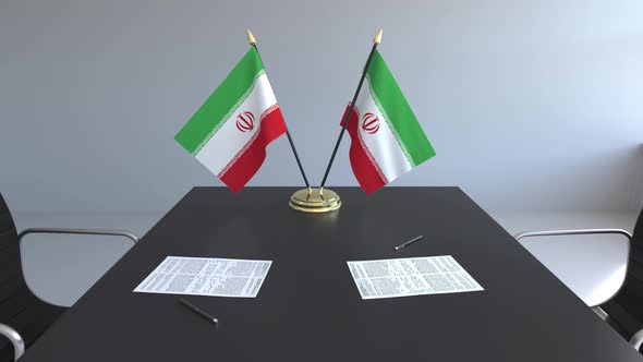 Flags of Iran and Papers on the Table