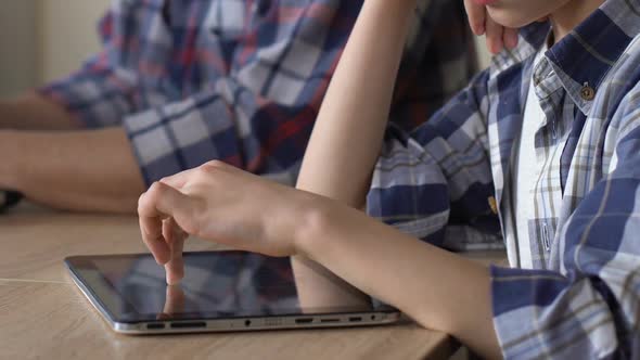 Upset Son Scrolling Pics on Tablet, Looking at Busy Father That Neglecting Child