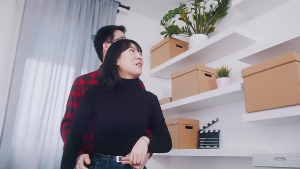 Happy Young Asian Couple Relocation to New Appartment