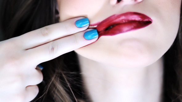 Girl Wipes Lipstick Lips