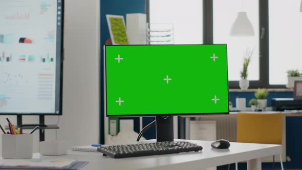 Close Up of Monitor with Green Screen at Empty Desk