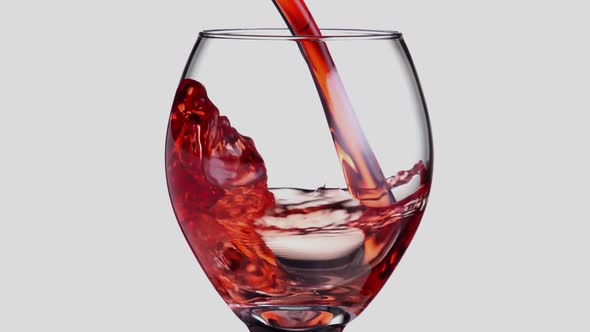 Slow motion shot of wine being poured into a glass