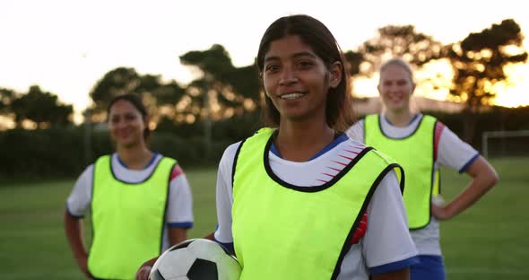 Female soccer player standing on soccer field. 4k