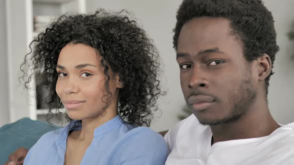 Young African Couple Looking in Camera