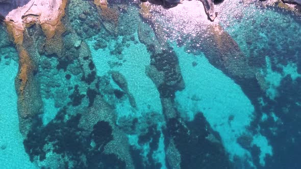 Transparent sea water near stony remote coast