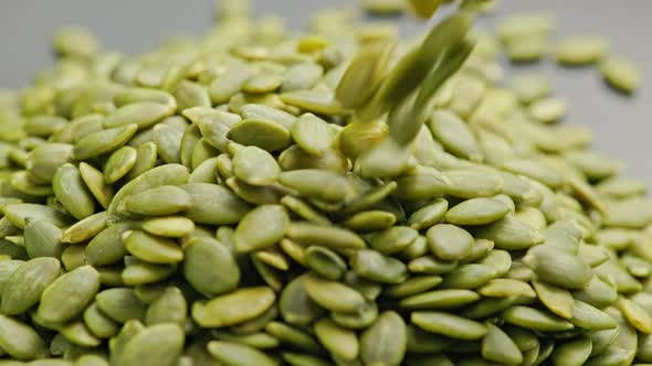 Peeled Pumpkin Seeds Pouring in a Pile