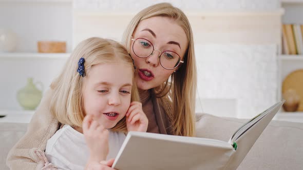 Portrait of Two People Family Young Single Mother Blonde Woman Mum Wearing Glasses Caring Mom Reads