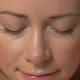 Face of young woman with eyes closed, zoom out to show her lying on massage table - VideoHive Item for Sale