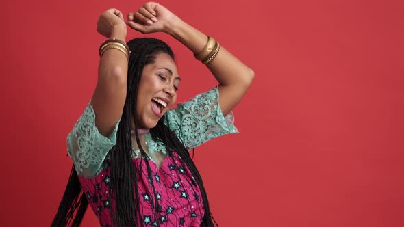 A happy african american woman dancing