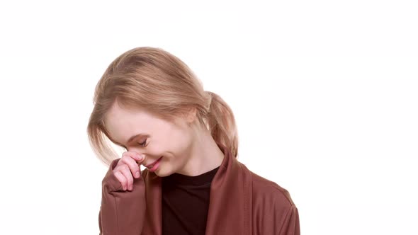 Beautiful Young Caucasian Teenager Girl Standing on White Background Laughing Smiling Looking at