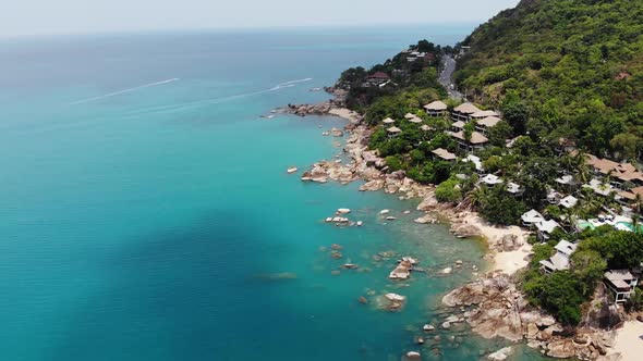 Small Houses on Tropical Island. Tiny Cozy Bungalows Located on Shore of Koh Samui Island Near Calm