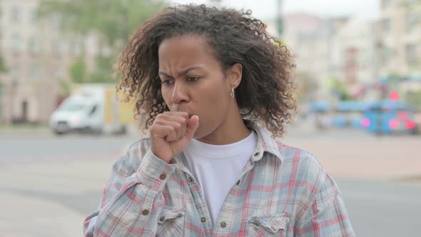 African Woman Coughing While Standing Outdoor