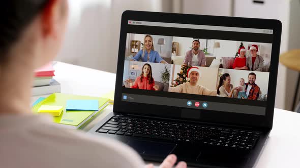 Woman with Laptop Having Video Call on Christmas