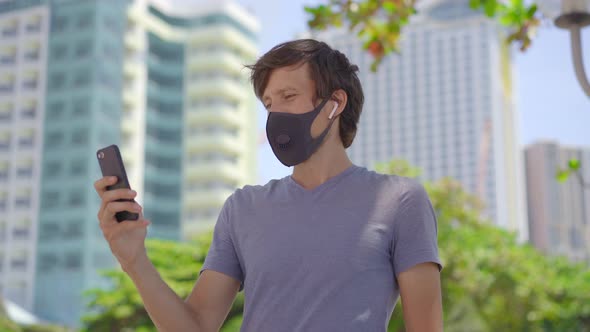 Fashionable Black Medical Mask with a Filter in the City. Coronavirus 2019-Ncov Epidemic Concept