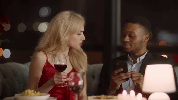 Wife Catching Husband On Infidelity While He Texting In Restaurant