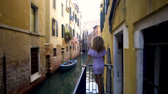 Travel To Italy. Girl Standing on the Bridge in Venice