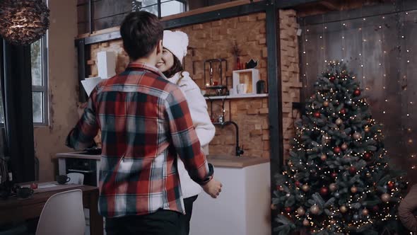 Crazy Young Couple Dancing and Having Fun on Christmas Evening.