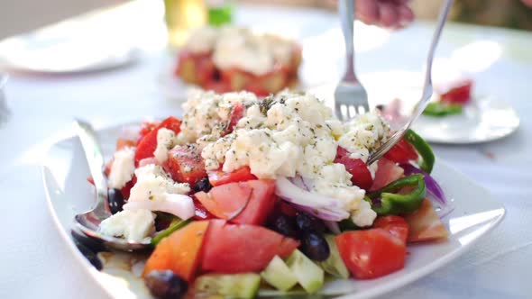 Fresh Greek Salad on a Terrace in the Mediterranean Sun
