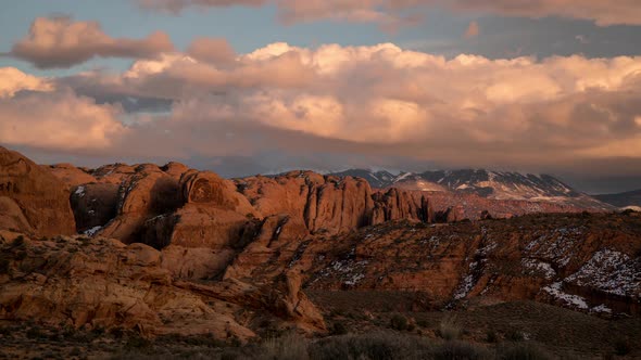 Time lapse of colorful sunset over desert rocky fin layers in Moab