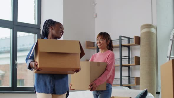 Women with Boxes Moving Out to New Home