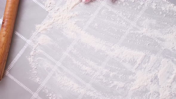 Apple Pie Preparation Series  Woman Covers Table with Flour for Rolling Dough