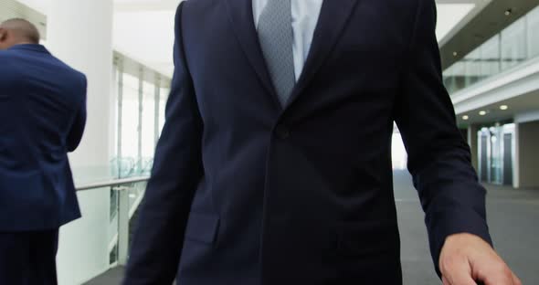 Businessman walking in a modern office building