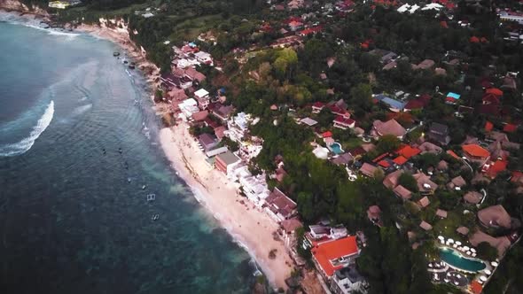 Beautiful Bingin beach with exotic cliffs houses located in Bali, Indonesia. This drone footage was