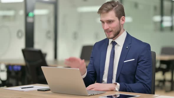 Businessman Talking on Video Call on Laptop