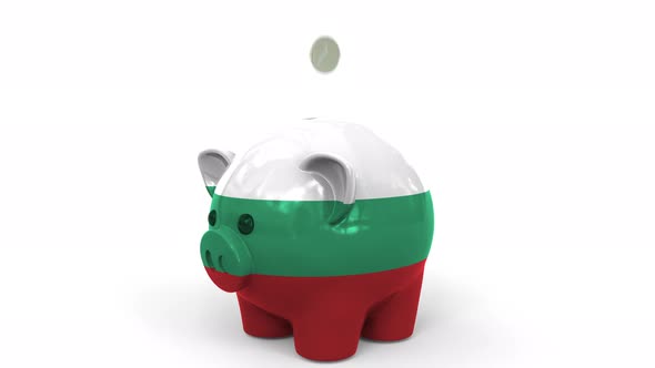 Coins Fall Into Piggy Bank Painted with Flag of Bulgaria