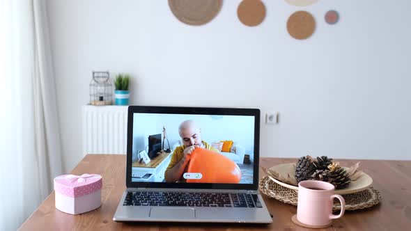 Man celebrating with video conversation on the internet.