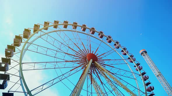 Ferris Wheel Over Blue Sky