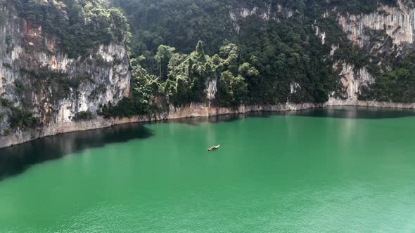 Drone Shot of the Boat Sailing Over the Lake of National Park of Thailand