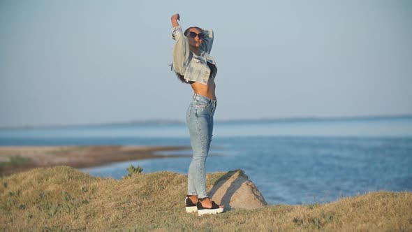 Girl in Jeans By the Sea