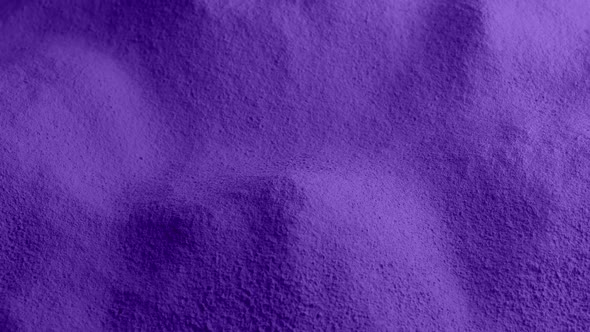 Powdered Purple Material Rotating Slowly