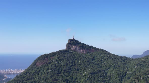 Panning wide view of Christ the Redeemer symbol of Rio de Janeiro Brazil