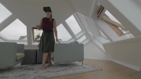 Woman Entertaining with VR-headset in Cube House