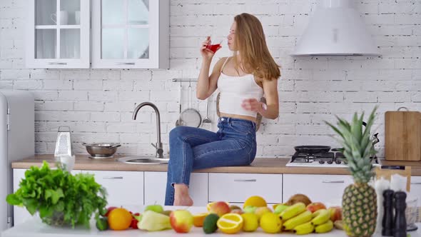 Beautiful woman on the table with juice