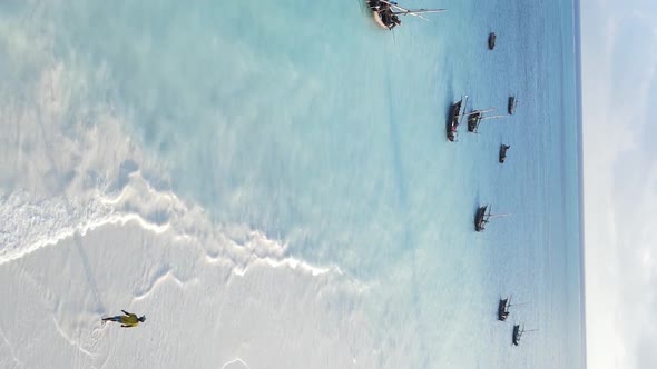 Tanzania Vertical Video  Boat Boats in the Ocean Near the Coast of Zanzibar Aerial View